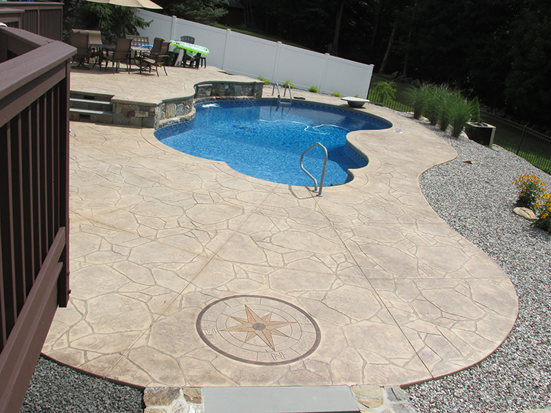 Swimming pool and stamped concrete project example 44
